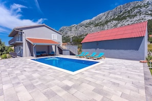 Pool area with covered poolside patio,4 sun chairs, BBQ and 36m2 private pool.