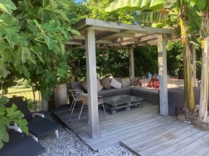 Relaxing shaded pool area next to pool