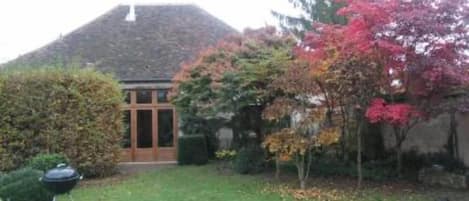 View from the garden, landscape designed garden in autumn