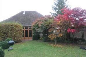 View from the garden, landscape designed garden in autumn