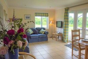 Pippin wing living room with wheelchair friendly doors to verandah.