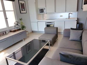 Living area and fully equipped modern kitchen