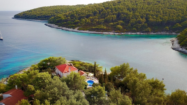 Aerial view of the house, pool with stunning panoramic view of Tri Luke bay