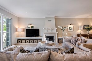 Living room with access to the pool