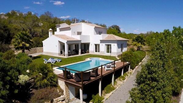 Aerial view of house and pool