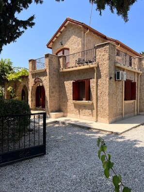 Front elevation with private off road parking. 