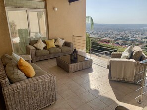 Soft seating area under pergola, with amazing views 