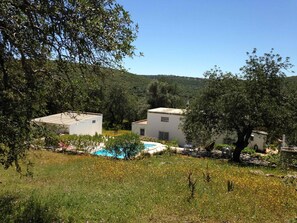 Rear view of the farmhouse and pool area