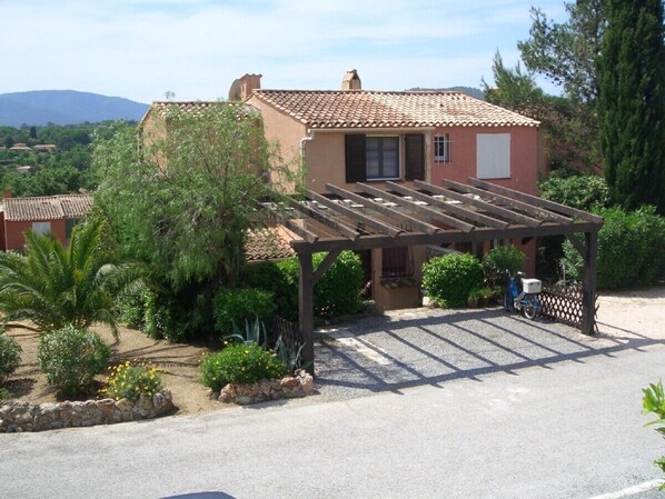 The house is on the left, with parking for two cars