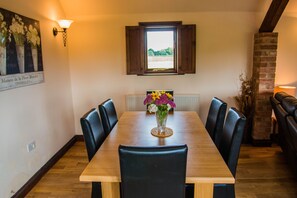 The dinning table pulls extends and more dinning chairs dotted around the barn