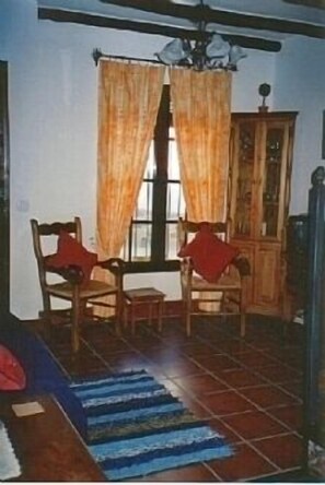 Cosy sitting room with wood burning stove