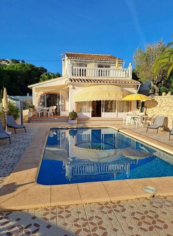 Villa Ra with an impossibly blue sky and wonderful reflection in the pool