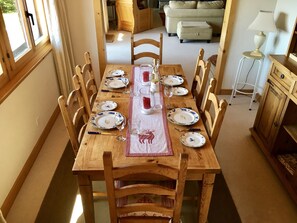 Dining room with extendable dining table leading to sitting room