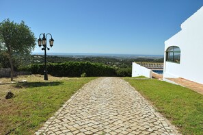 A perspective of the views and the plot with the private cobblestone road.