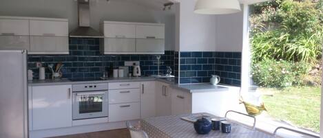 Well equipped kitchen diner - bright room to cook & relax -looks out into garden