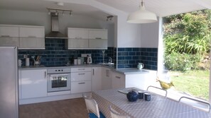 Well equipped kitchen diner - bright room to cook & relax -looks out into garden