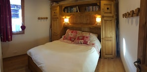 The main bedroom, super comfy traditional double Savoie bed and surround