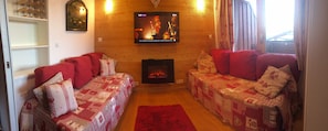 The comfy, cosy seating area. TV with DVD players and HDMI cable. 