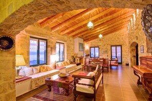 A large living room, ideal for the whole family to gather and relax together.