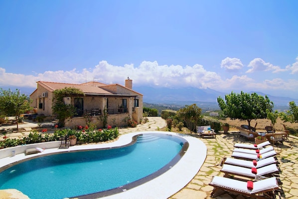 A uniquely shaped swimming pool, adding charm and character to the space.