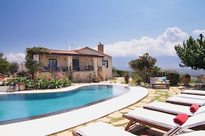 A beautiful view of the villa and pool terrace, blending comfort and relaxation.