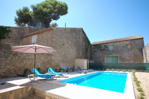 The pool is not overlooked, the barn is empty and part of the house