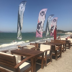 Eat on the beach yards from the waves at Surf Beach, 5 minutes walk from villa.