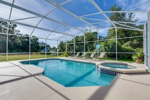 Large pool deck and spa overlooking the conservation area