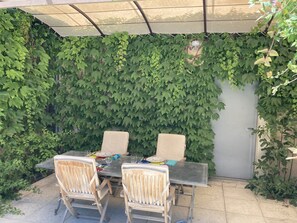 Outside eating area and door to garage