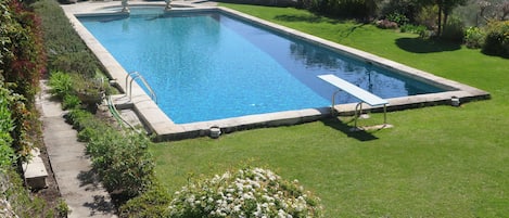 The beautiful swimming pool in the chateau gardens