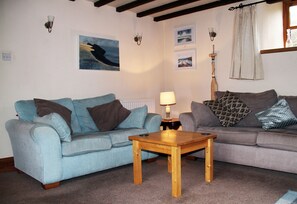 Lounge with sofas to seat 7 and TV/DVD player