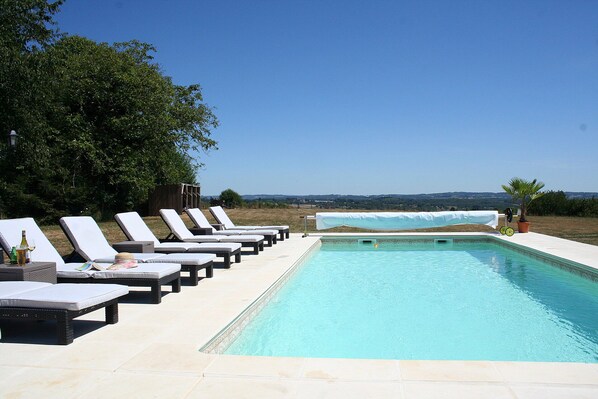 Swimming pool and sun terrace with panoramic far reaching views