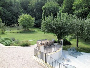 The perfect area for outside dining just above the pool