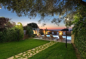 Private & fenced outdoor area with pool, sun beds, umbrellas dining table & BBQ!