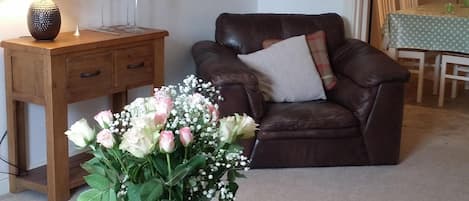 The spacious lounge at Brae Cottage with 55" TV