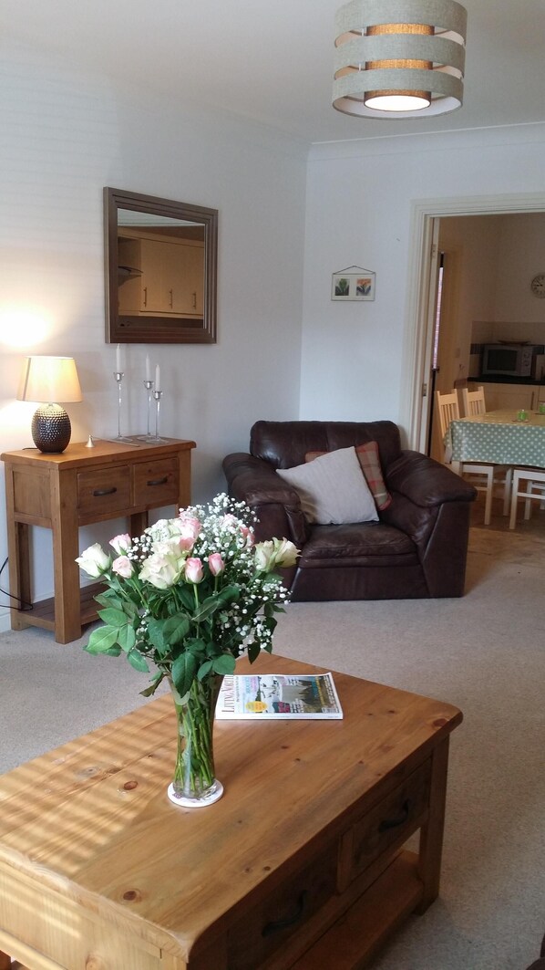 The spacious lounge at Brae Cottage with 55" TV