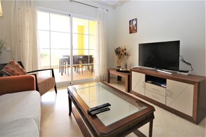 Modern and bright lounge area with air conditioning and international TV channels