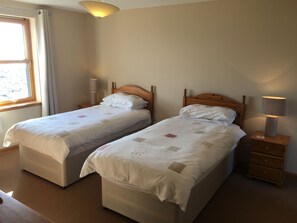 Twin bedroom with sea views