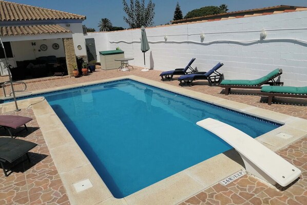 Pool 8m x 4m. Depth 1.5m to 2.6m. A suntrap . Diving Board, many sunloungers
