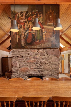 We challenge you to identify this very old painting!  Dining table seats 14.