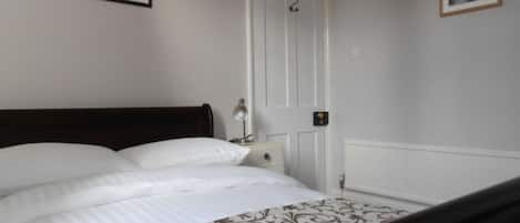 The second bedroom with standard mahogany sleigh bed.