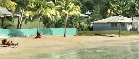 Calypsosteps away from white powder Galleon Beach with calm clear sheltered sea