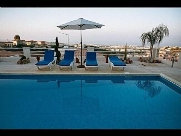 Relax by the pool with panoramic sea view