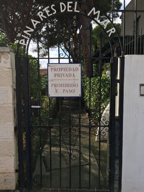 Gated entrance to PINARES DEL MAR