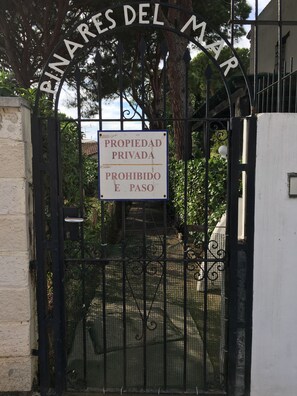 Gated entrance to PINARES DEL MAR