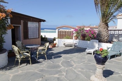 Cottage with large garden on the beach