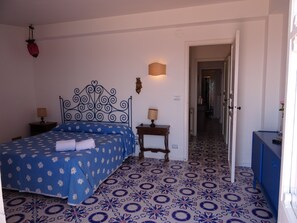 bedroom with balcony overlooking the sea