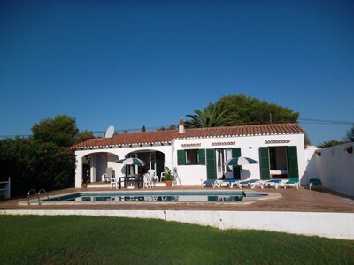 Detached villa with private swimming pool in landscaped gardens.