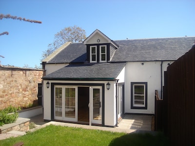 Luxury cottage with garden and parking in the heart of the village.  Sleeps 8.