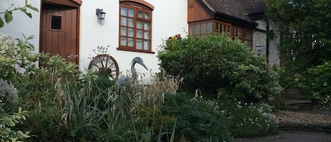 Heron View porch and fish pond